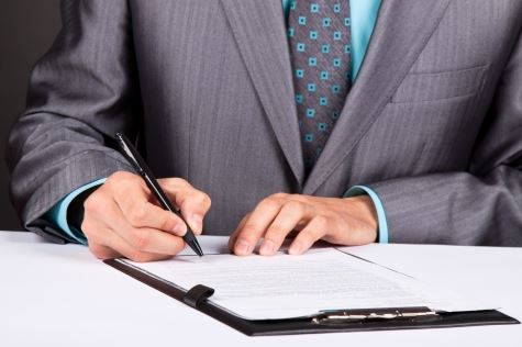 Man Signing a Document 